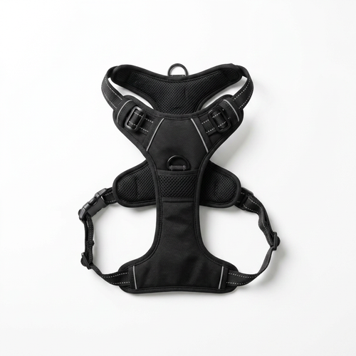 No-pull dog harness laid flat on a white background, showing the front chest ring and the side buckles