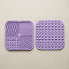 Both sides of the dog lick mat showing the ridge, dot, cross and honeycomb textures