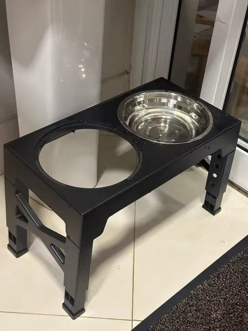 The black raised bowl stand seen from above with one stainless bowl fitted