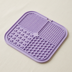 Collar and Crest dog lick mat on a plain brand background
