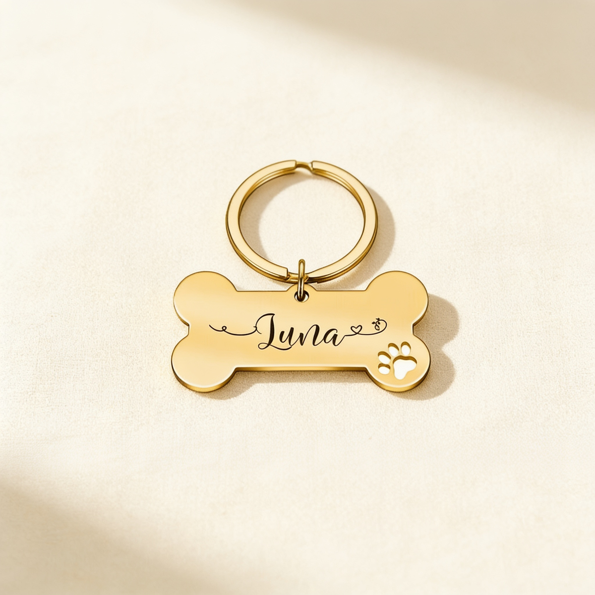 Collar and Crest engraved dog tag on a plain brand background