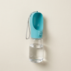 Collar and Crest portable dog water bottle on a plain brand background