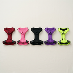 The no-pull dog harness in all five colours: black, red, pink, purple and neon yellow