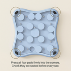 Close-up of the four rubber foot pads on the underside of the dog puzzle toy
